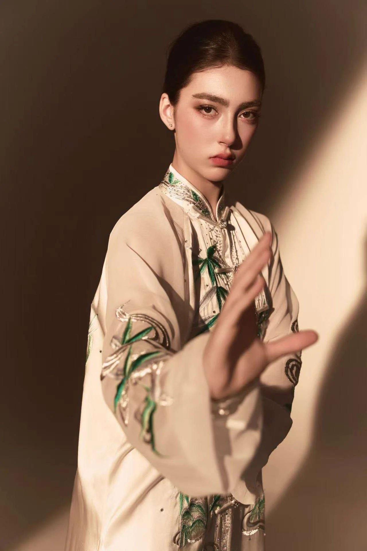 Annie Harris — wushu editorial, three-quarter portrait, mid-block, warm shadow